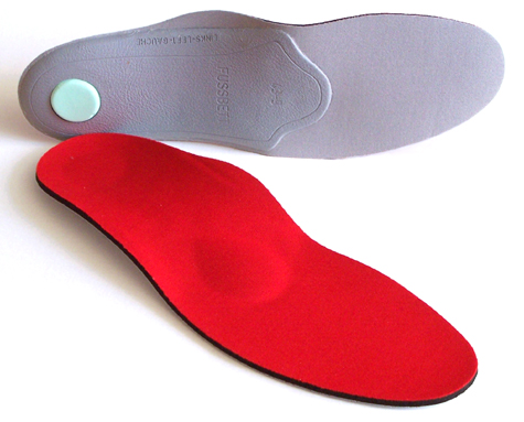 Pedag Pro-Active XCO extra cushioning orthotic arch support pair with one face up and one on its side