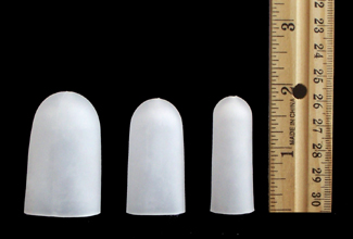PediFix gel toe caps all three sizes next to ruler showing height of about 2 inches